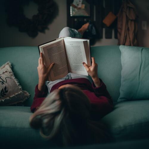 bird's eye view of a woman reading a book