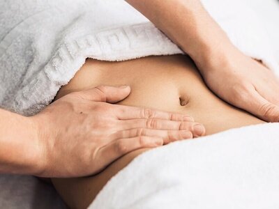 woman receiving a mayan abdominal massage