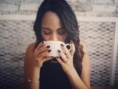 woman drinking coffee while ttc