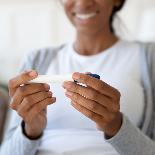 woman looking at an ovulation test