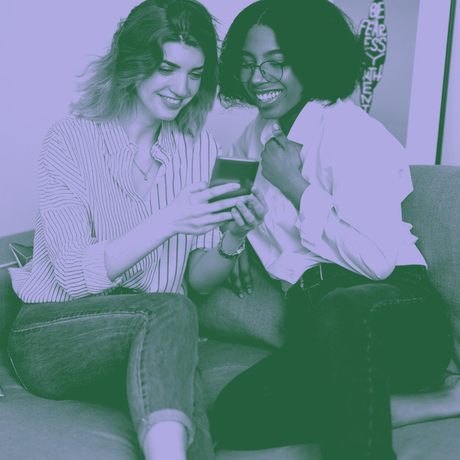 lesbian couple using rescripted.com on a mobile phone